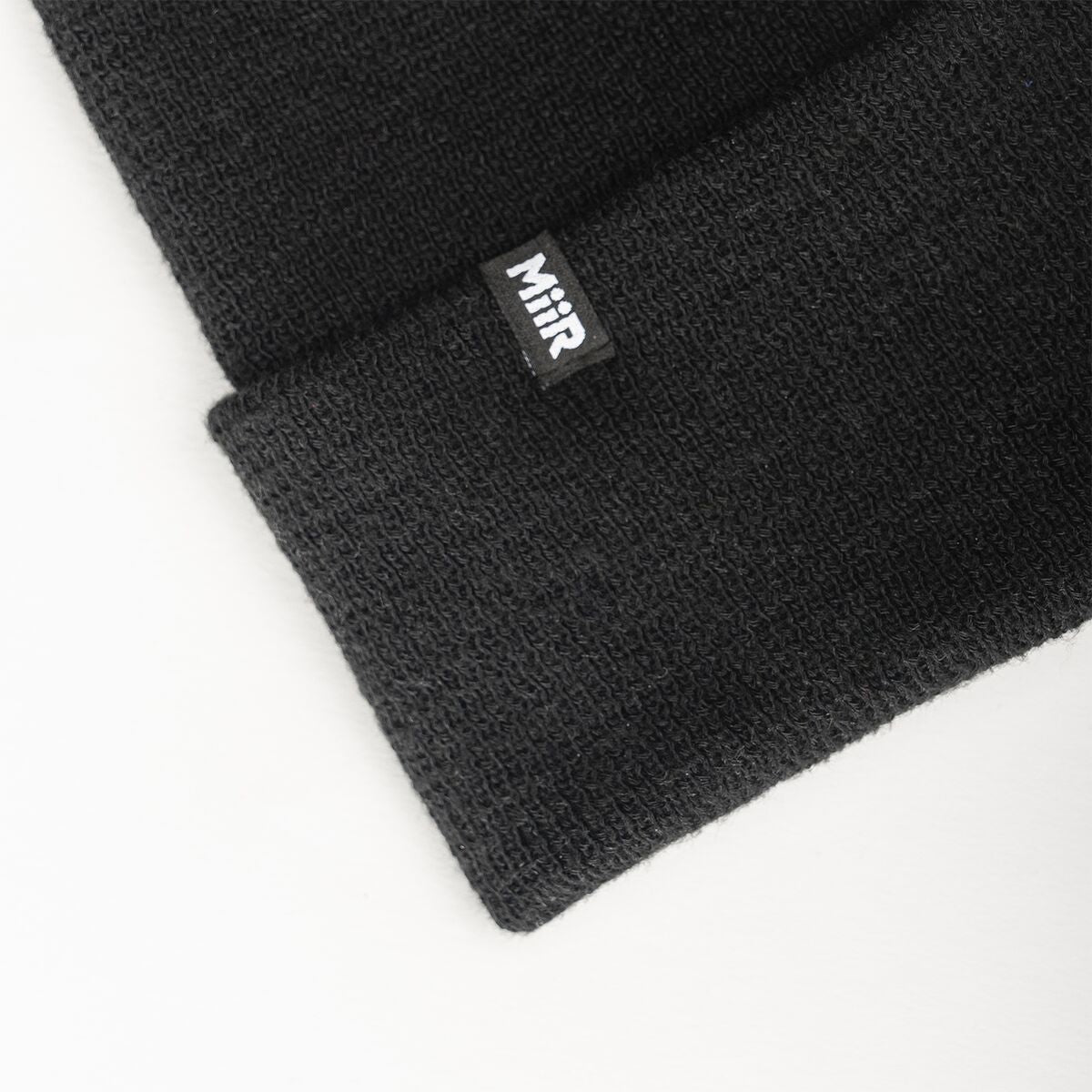 recycled-poly-fine-knit-beanie-m8 WebPDP-RecycledPolyFineKnitBeanie_Studio_TagDetail_Black__BNE005002OS.jpg