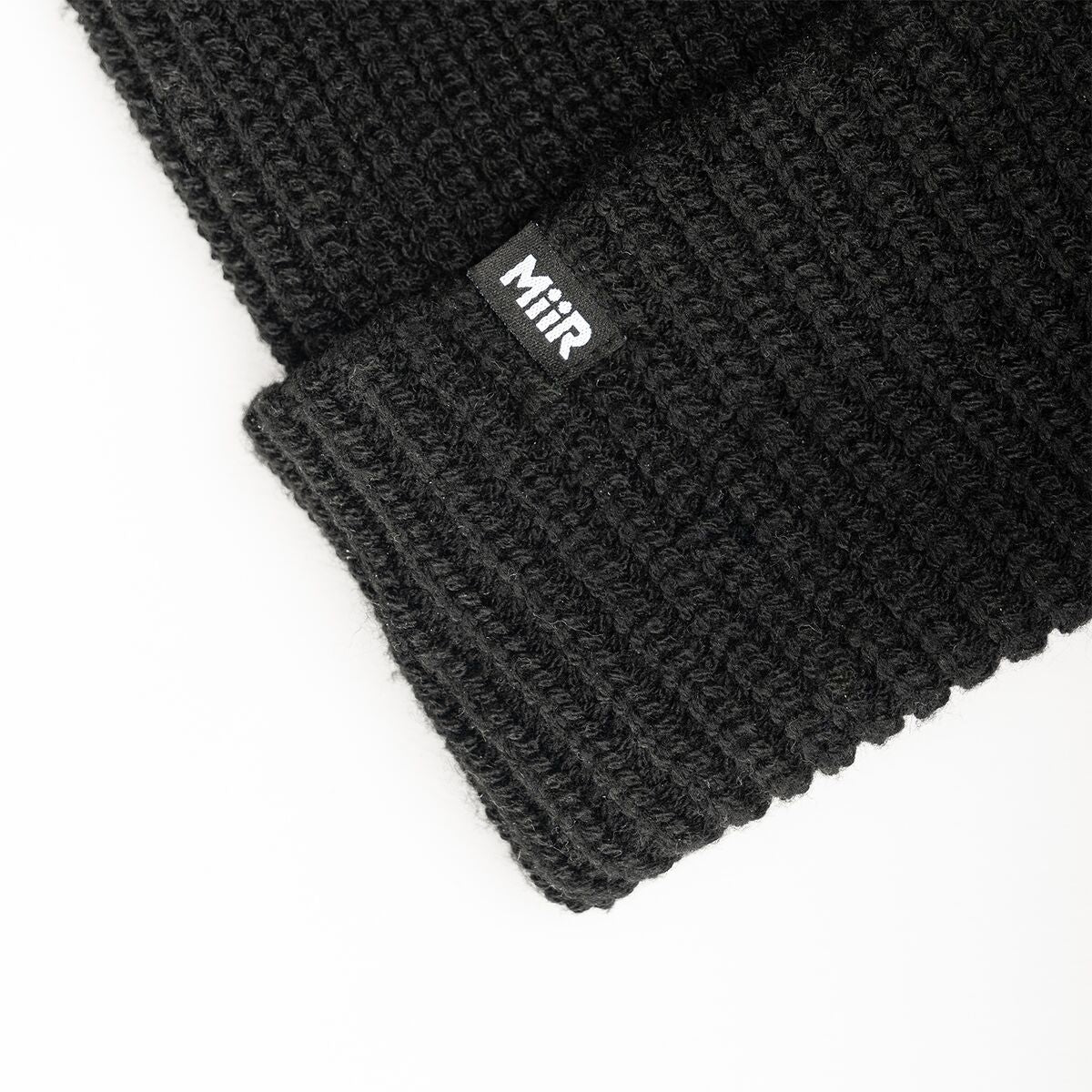 recycled-poly-rib-beanie-z5 WebPDP-RecycledPolyRibBeanie_Studio_TagDetail_Black__BNE002002OS.jpg